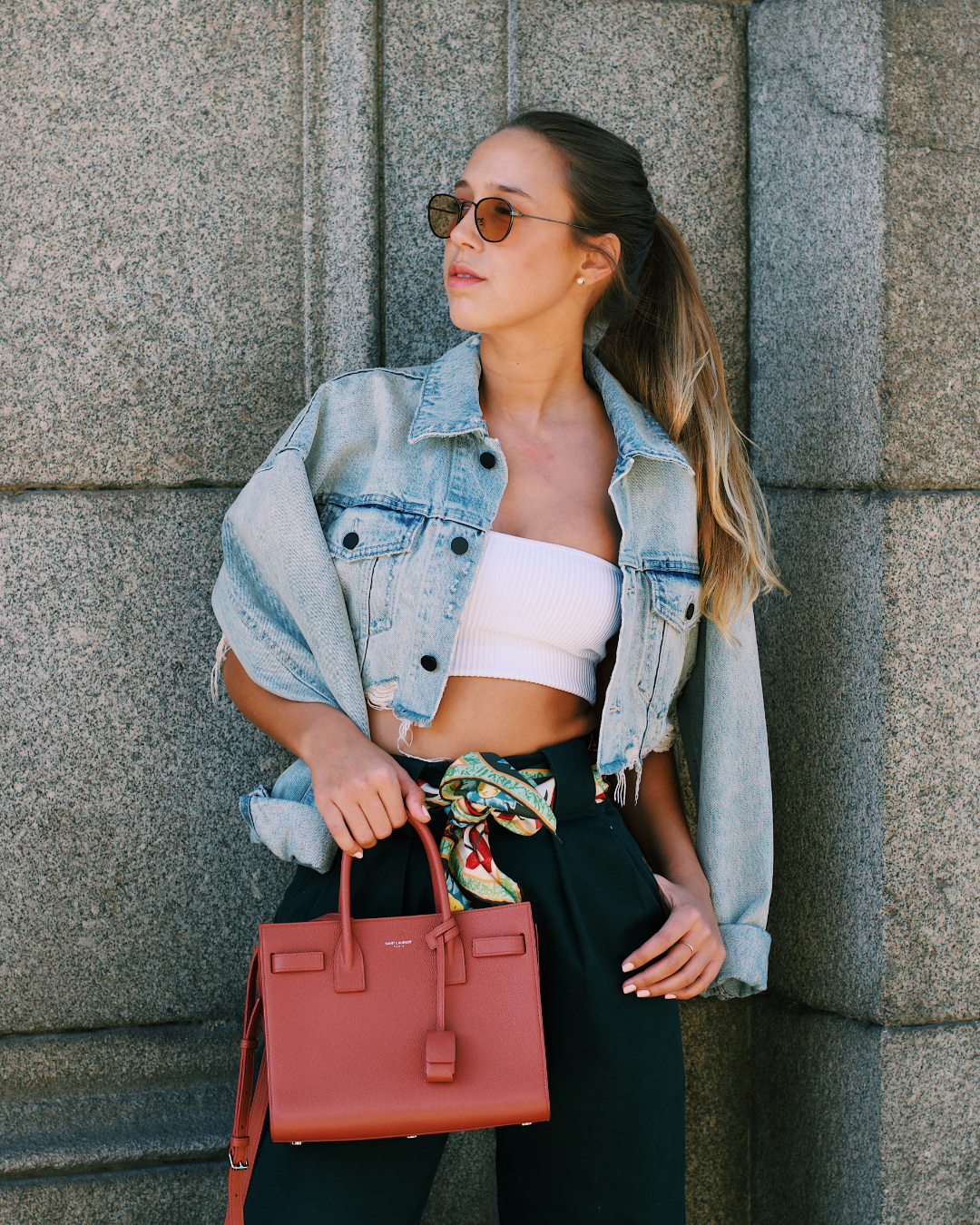 Woman posing with a Celine bag