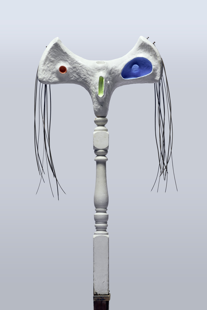 Multimedia abstract sculpture in wood and other materials. Painted white with sections of blue, red and green 