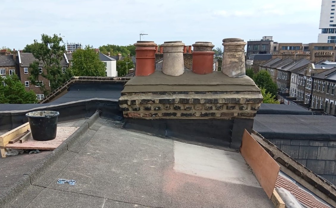 A photograph of the main roof and chimney after extensive repairs were carried out in 2025