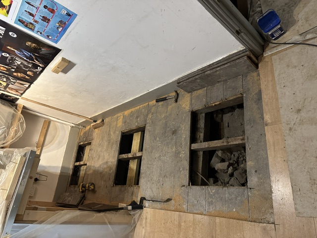 Access points to the cellar inserted in the ground floor of the building