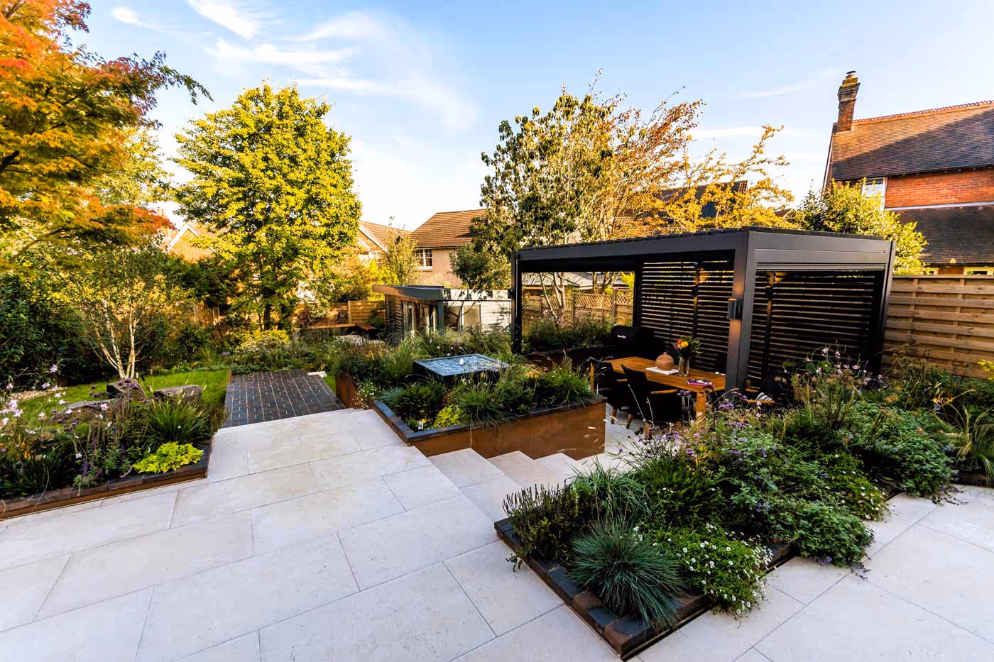 Small-water-feature-surrounded-by-planting