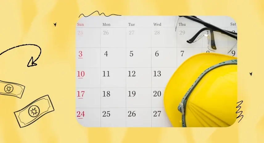 Calendar with a yellow construction helmet and safety glasses placed on top.