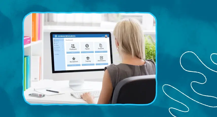Woman using HR software on a desktop computer.