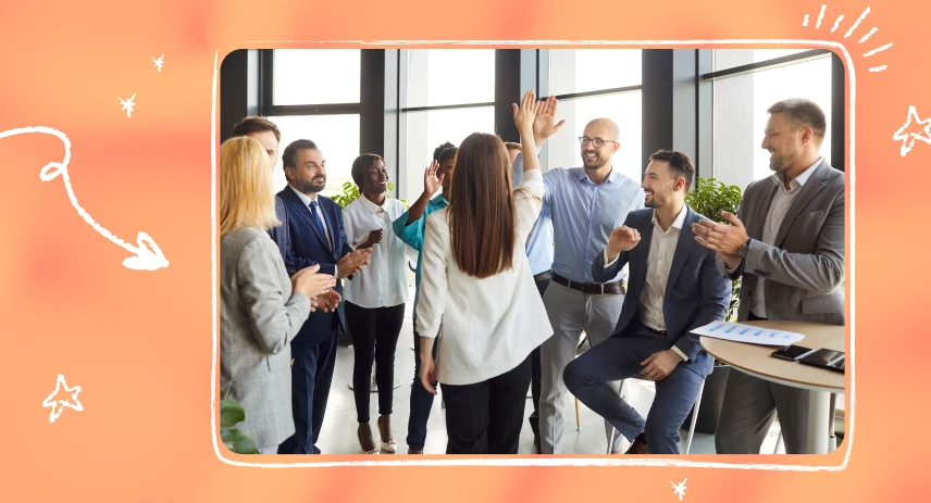 Image of a group of people celebrating at work.
