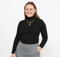 Portrait photo of Cloey Callahan in black turtleneck against white background