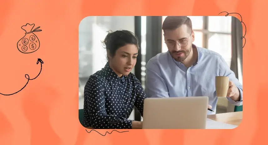 Image of a man and a woman in a workplace setting looking at a computer.