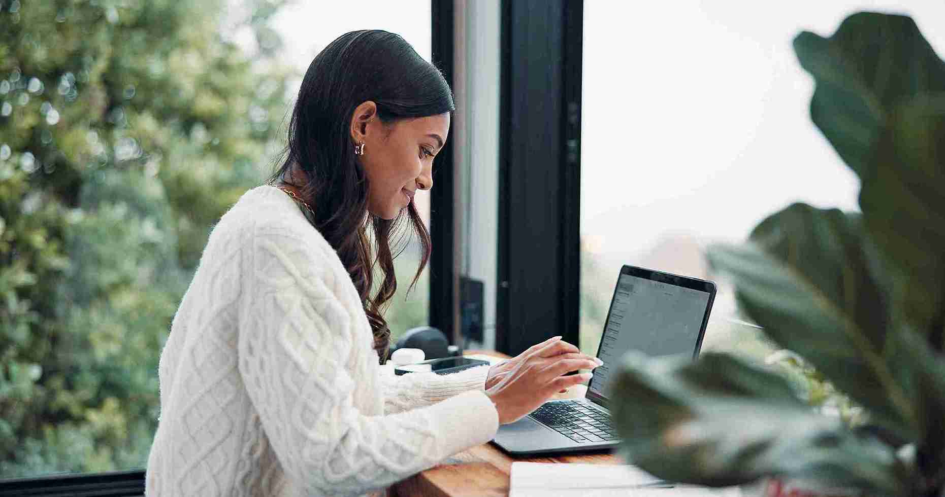 A woman sitting in front of her office computer.