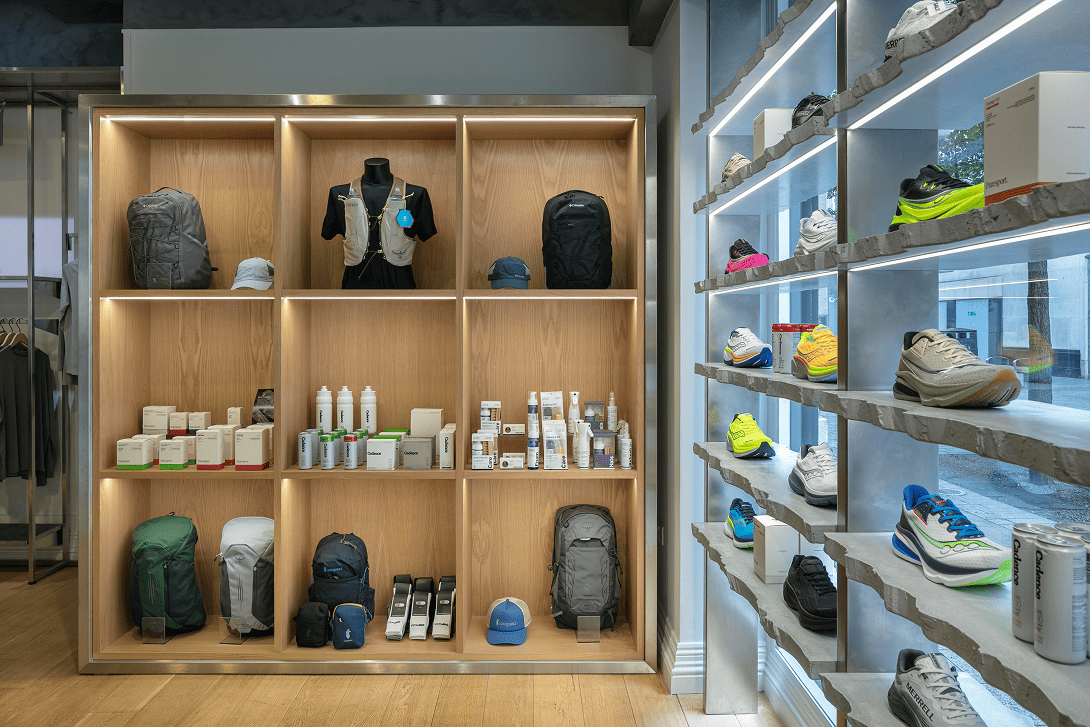 Bespoke accessories display unit at the Drip Moda Liverpool retail store featuring a stainless steel surround, recessed LED illuminated shelving and custom retail merchandising fixtures manufactured and installed by Bobblehat.