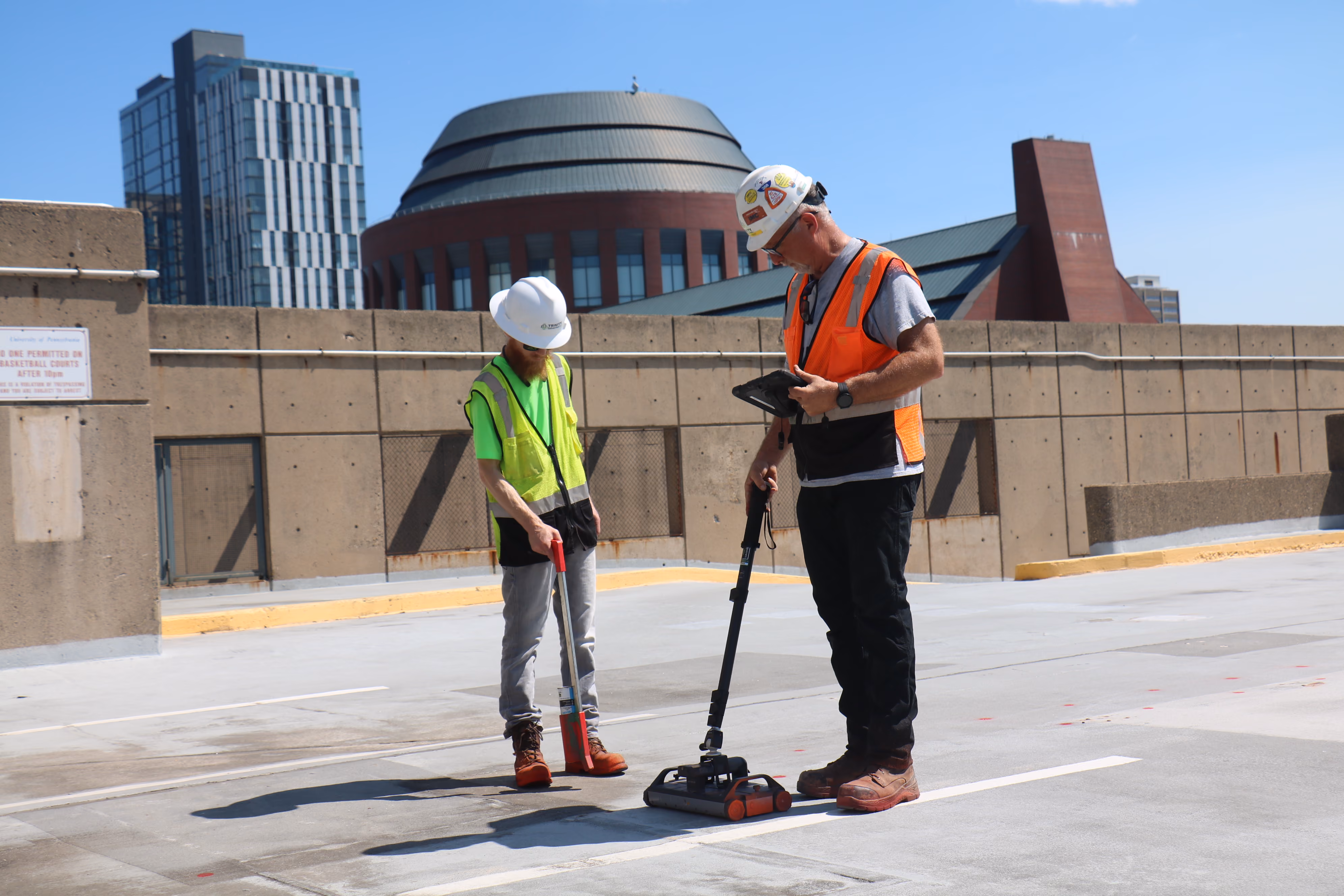 An image of GPR concrete scanning technicians at a parking garage.