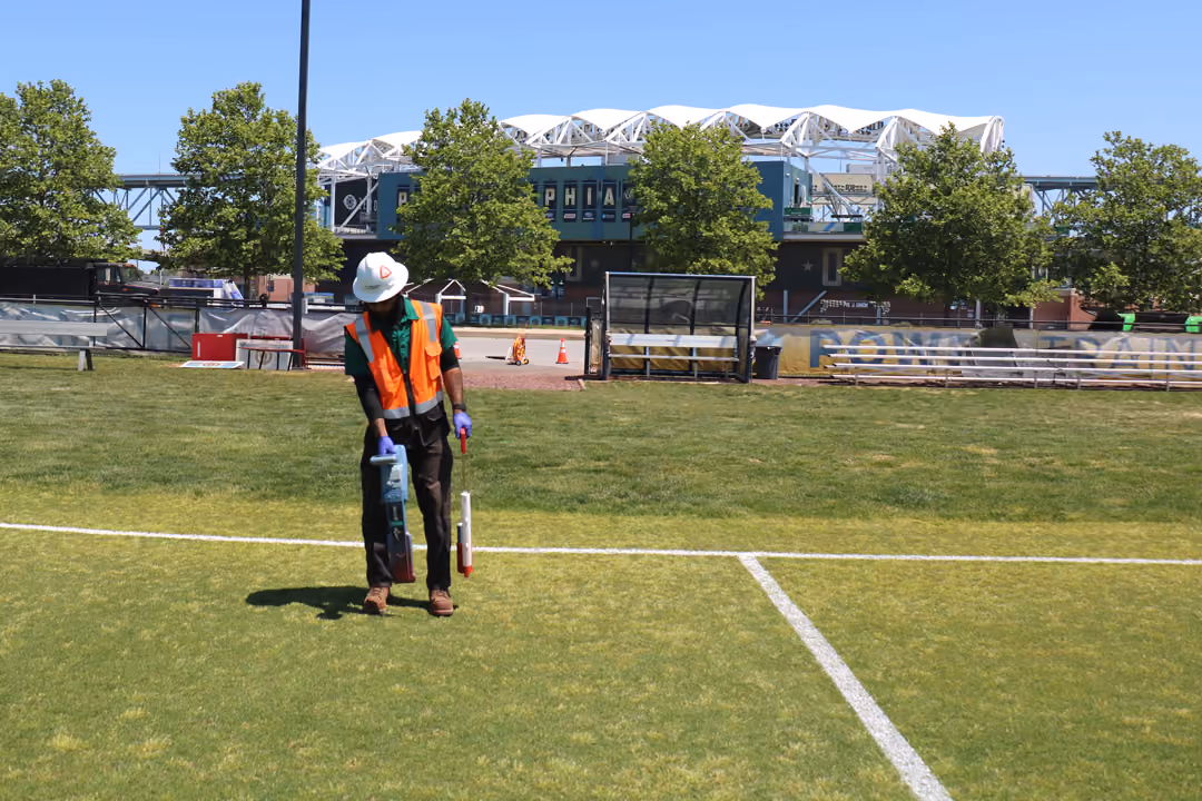 An image of a utility locator outside of a sports stadium.