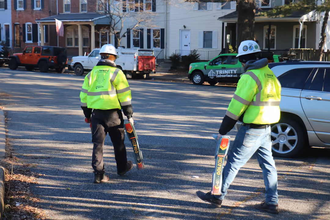 An image of two utility locators in a residential complex.