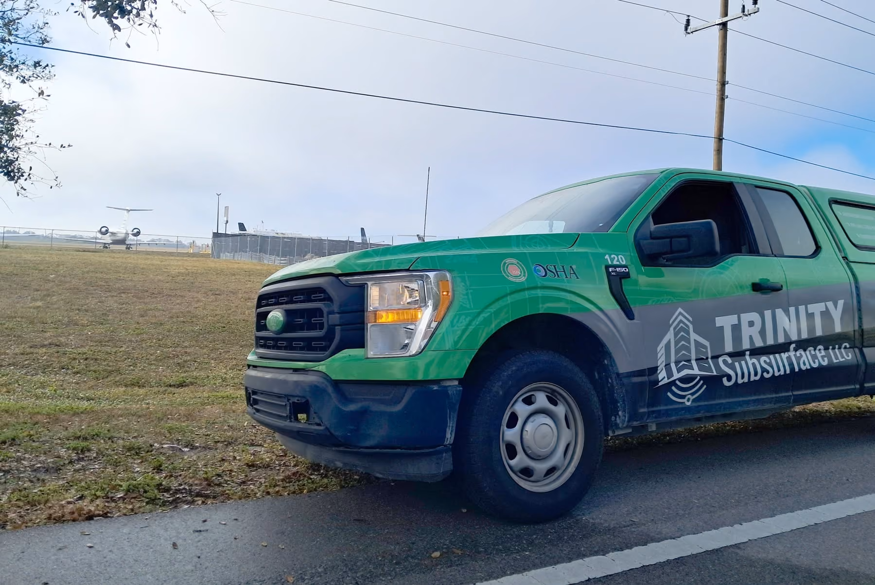 An image of a Trinity Subsurface truck near an airport in Florida.