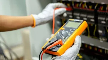 Electrician taking electrical reading