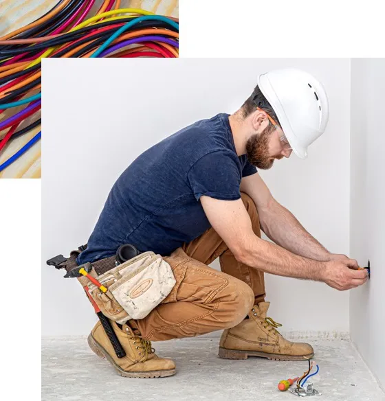 Electrician installing outlet in new home