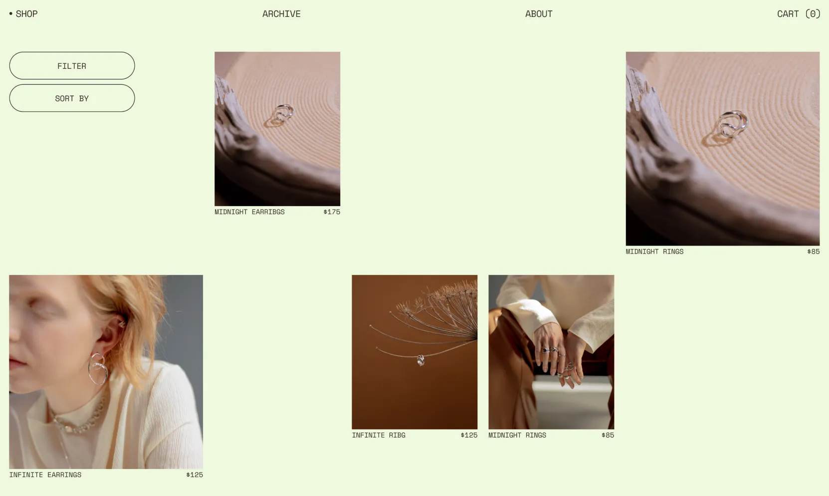 Jewelry shop webpage displaying earrings and rings with prices and filter and sort buttons on pale green background.