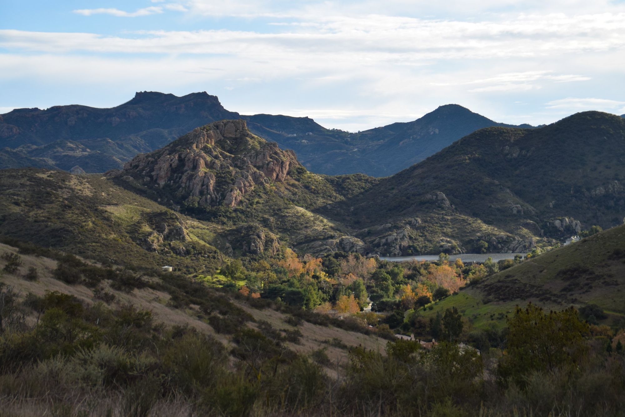 Rocky peaks above a lake in the Santa Monica Mountains, in a Lindero Blue duotone