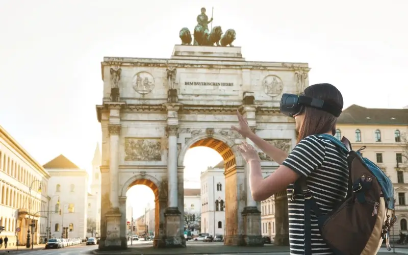 Traveler wearing a VR headset exploring a historical landmark virtually.