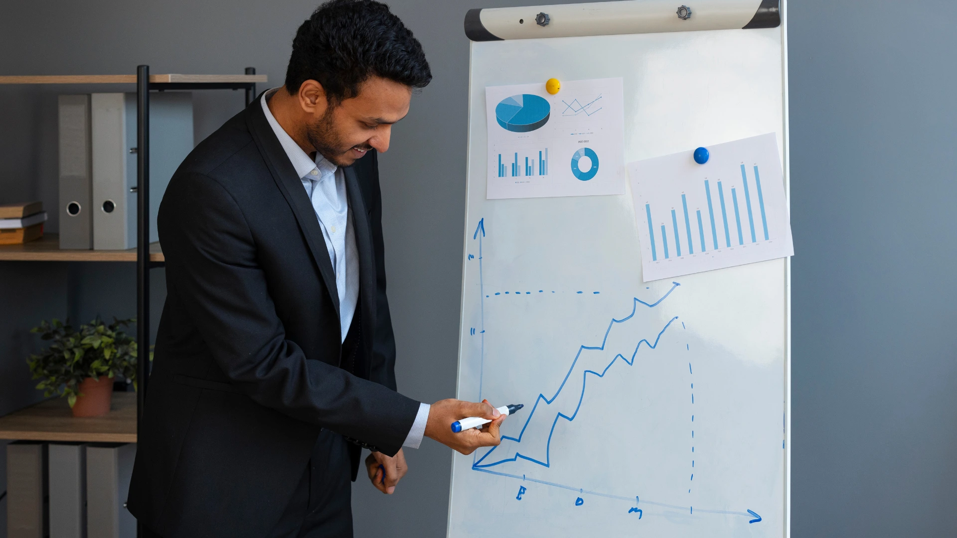 Professional analyzing the performance charts of a University Virtual Career Fair on a whiteboard