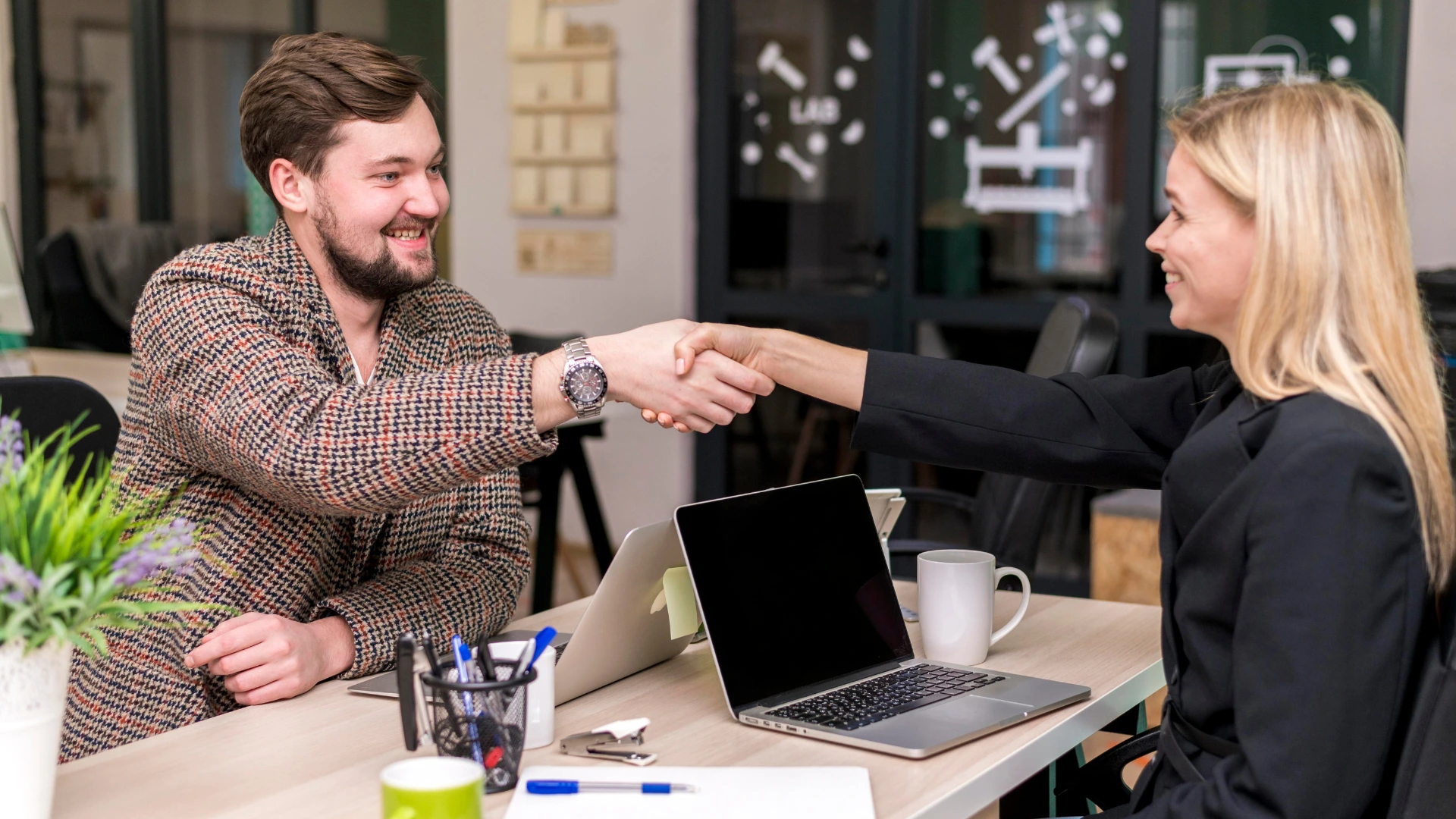 Business handshake symbolizing a successful event sponsorship agreement between partners.