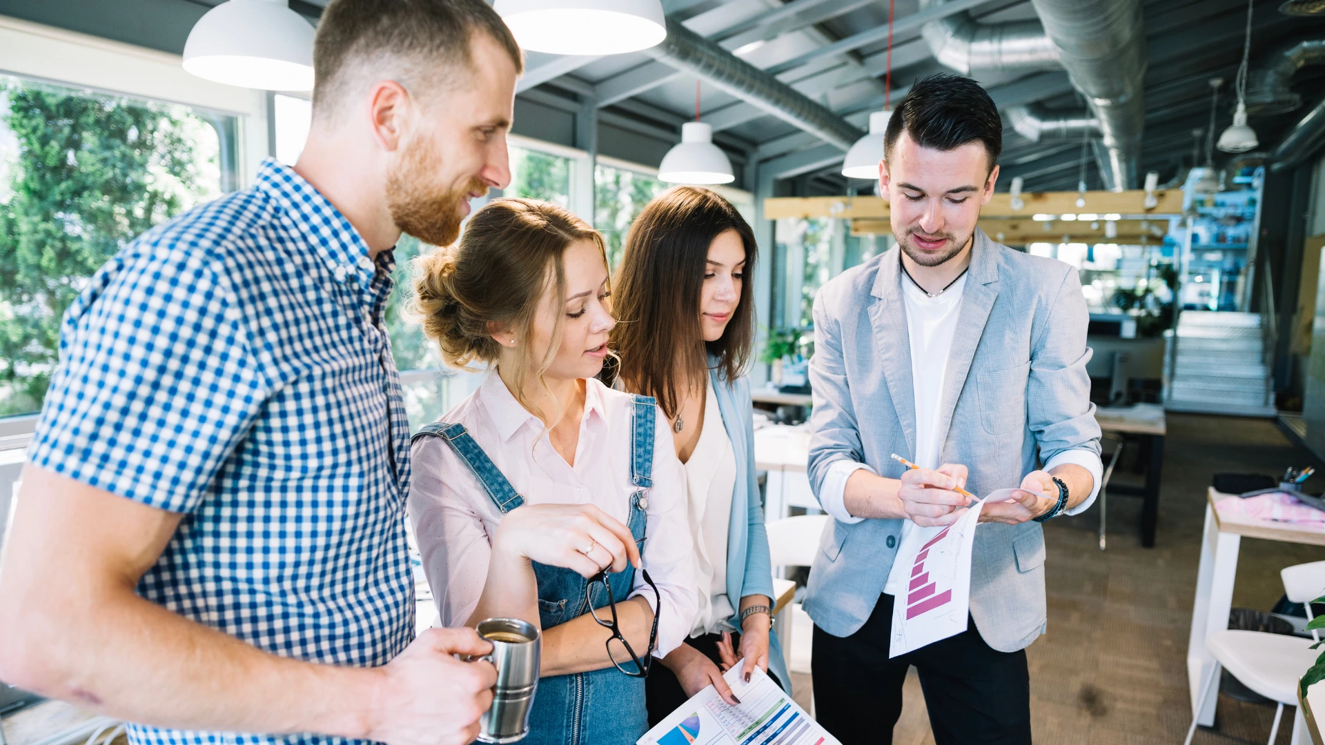 Marketing team analyzing performance data while planning event sponsorship strategies and partnership outcomes.