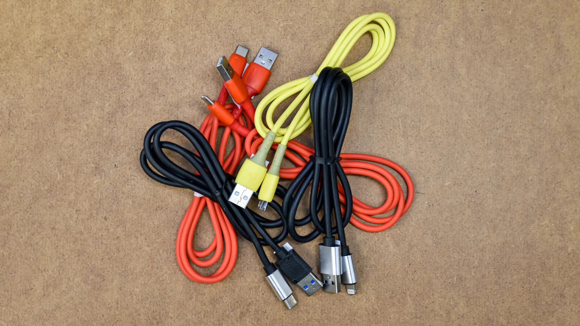 Assorted USB and charging cables neatly bundled together.