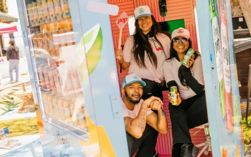 Simply Pop branded photo booth activation engaging attendees at outdoor event sponsorship experience.