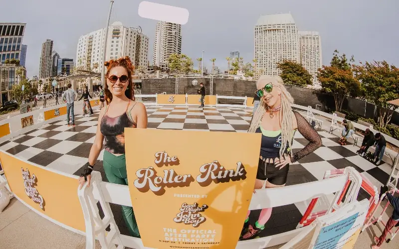 Sponsor-branded pop-up roller rink activation creating immersive event sponsorship experience at outdoor venue.