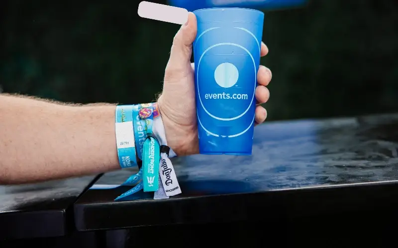 Sponsor branded wristbands showcasing event sponsorship activation at a live event.