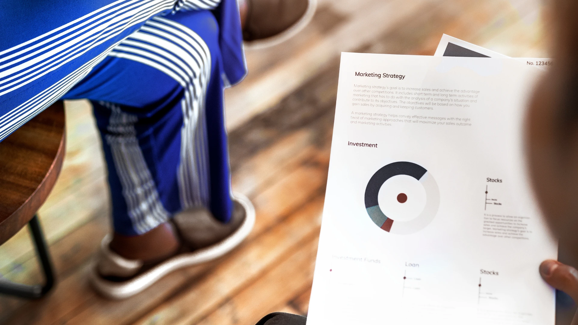 Business professional presenting sponsorship proposal insights during a formal meeting.