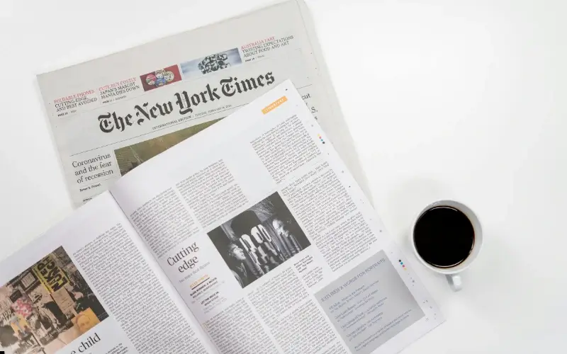 Editorial media sponsorship example showing a newspaper feature and magazine spread providing coverage and brand visibility for an event.