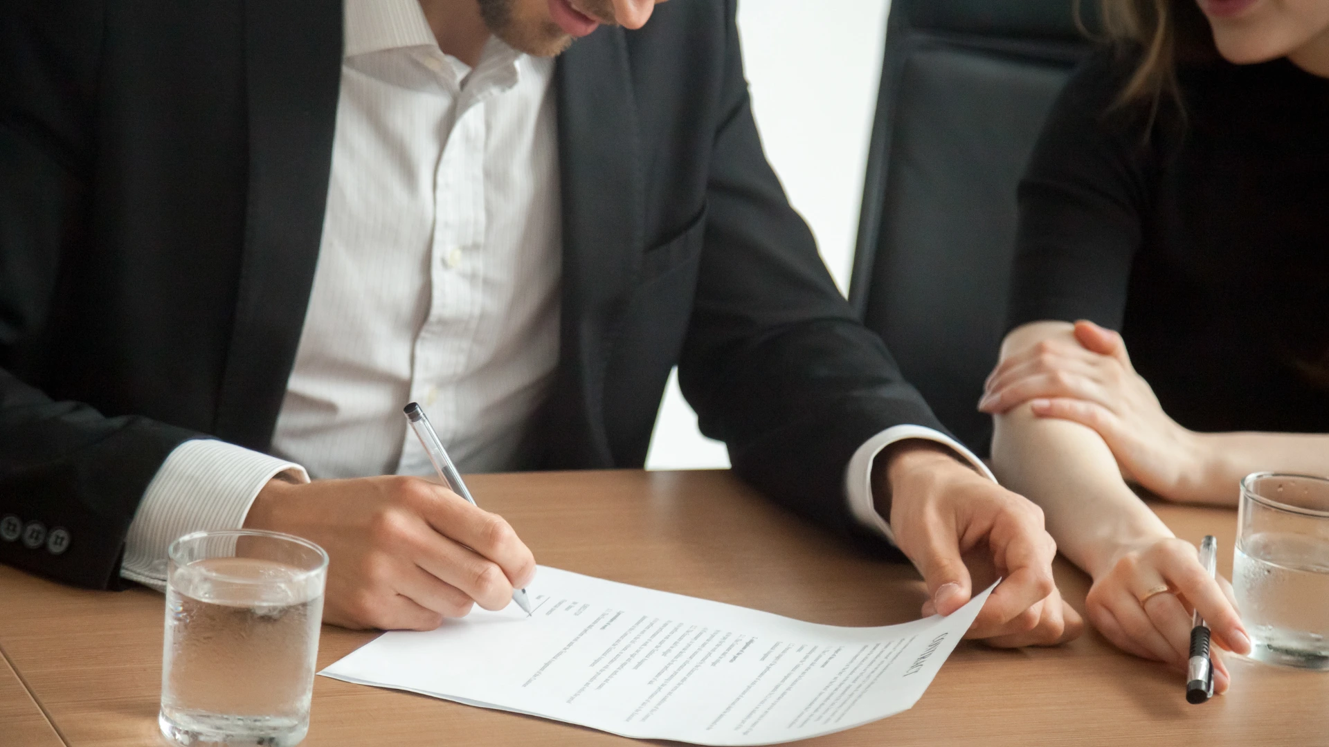Signing an event sponsorship agreement contract between sponsor and organizer.