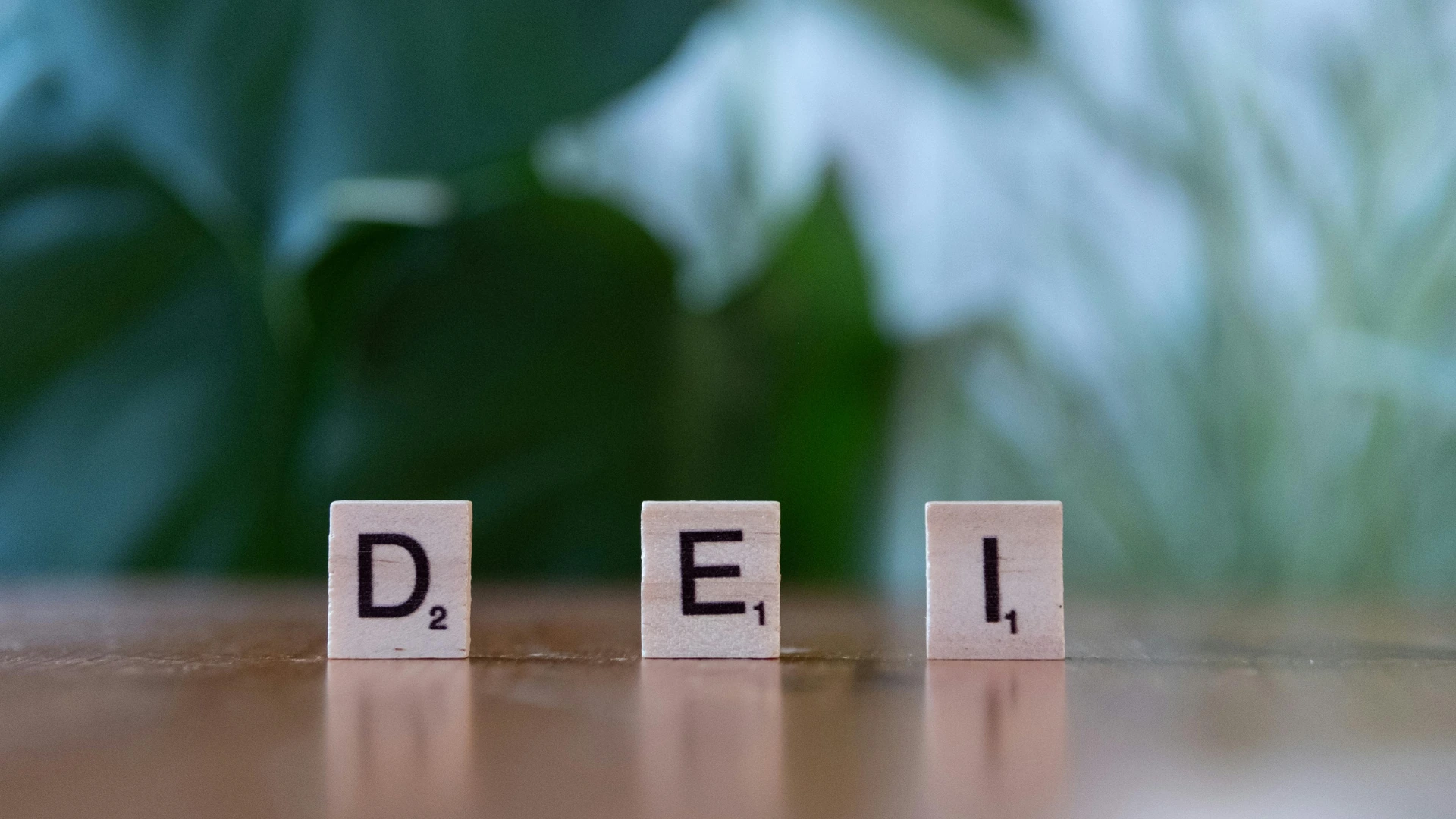 DEI concept displayed with letter blocks representing diversity, equity, and inclusion in hiring.