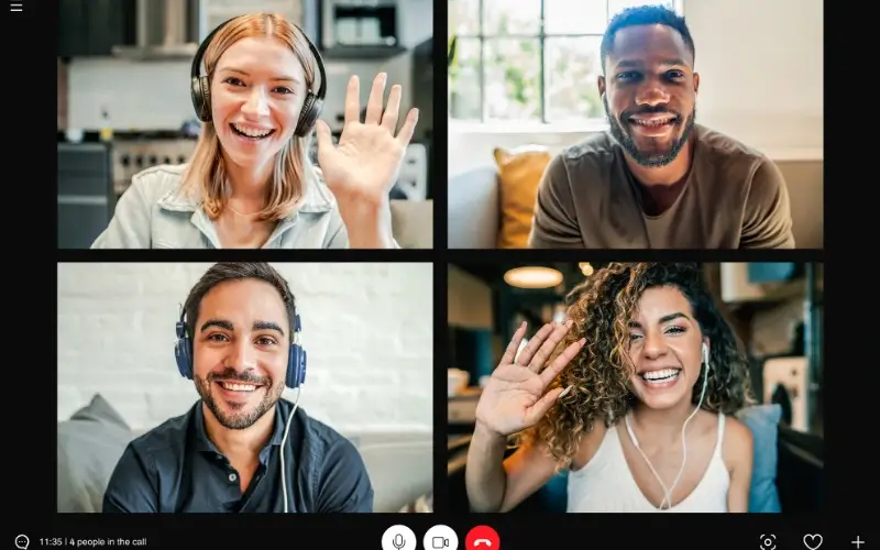 A four-person virtual meeting where participants are friendly and engaging with one another during zoom breakout room session.