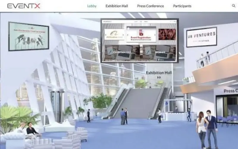 3D virtual event lobby interface featuring escalators, digital display screens, and attendee avatars in a brightly lit modern hall.