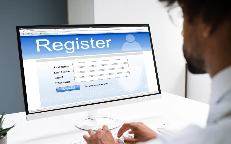 Webinar registration page displayed on a computer screen with name, email, and password fields.