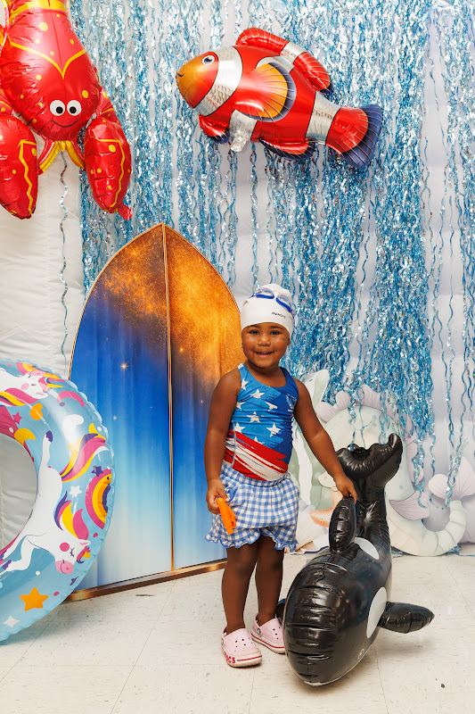 A young swimmer at the festival photo wall