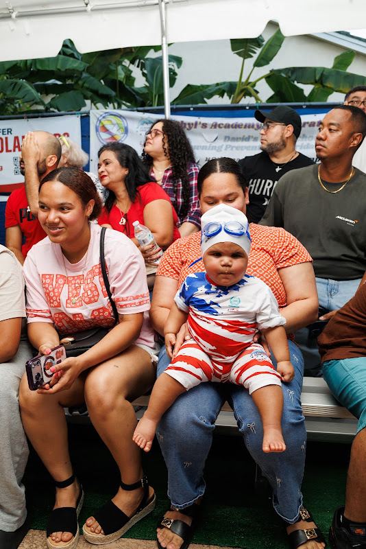 Families cheering for the swimmers