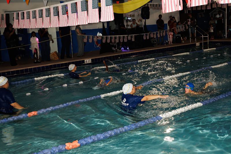 A coach in the water with swimmers