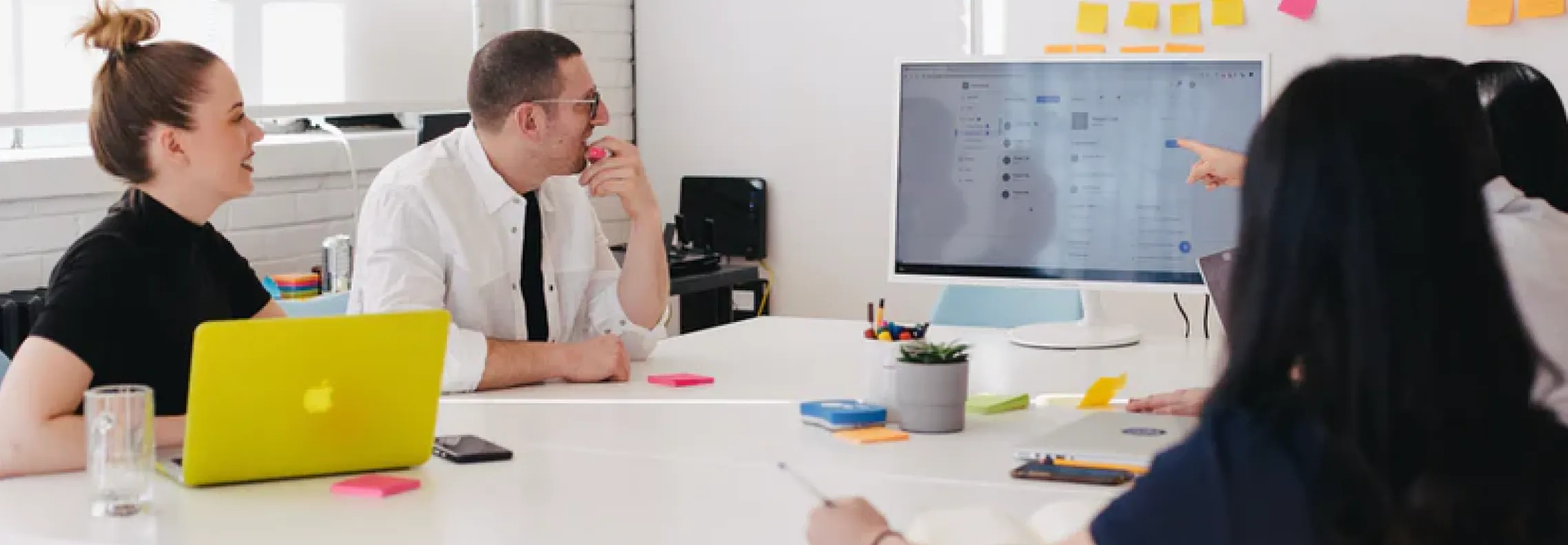 A group of co-workers at a conference table.