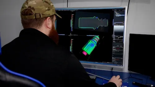 Engineer analyzing CT data with specialized software.
