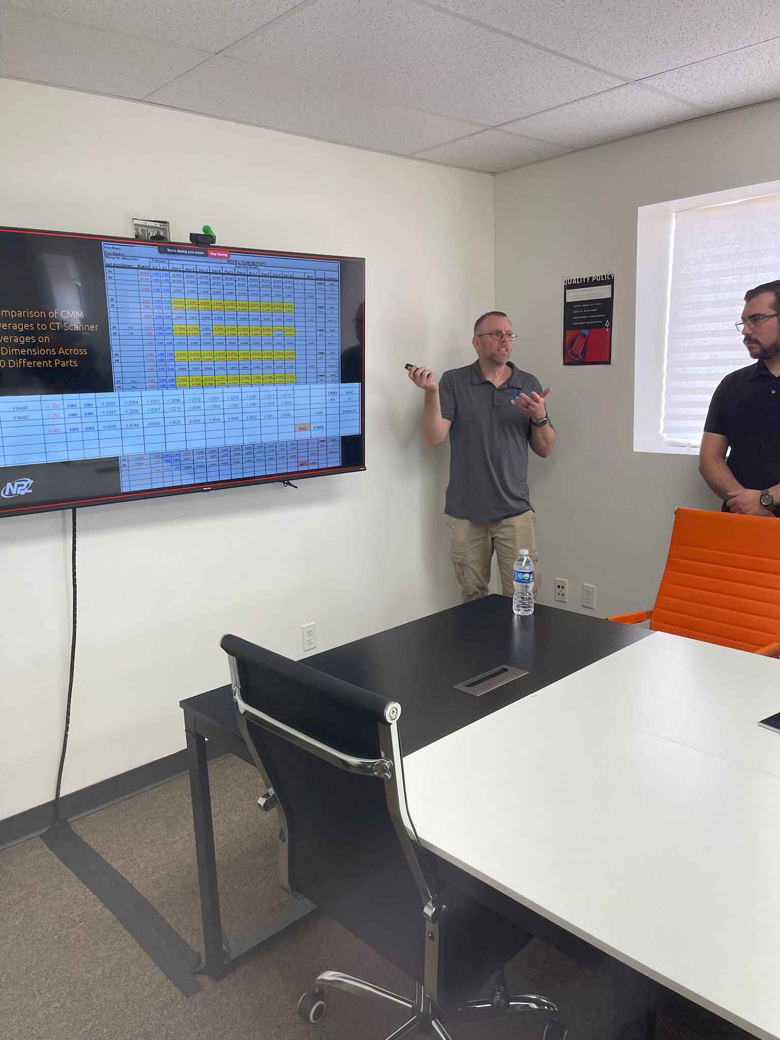 An engineer explaining measurement uncertainty and accuracy of industrial CT scanning
