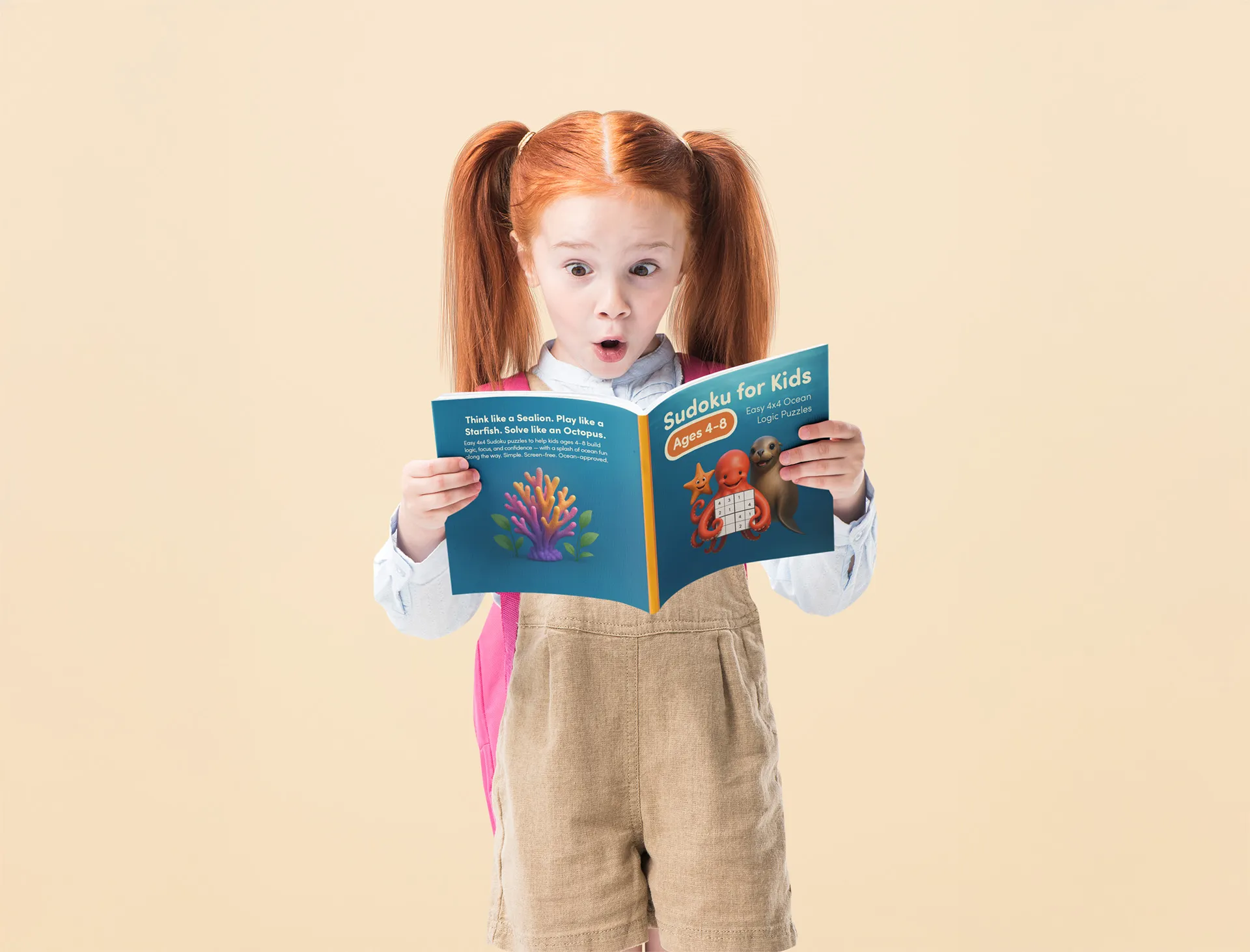 Kid holding Sudoku for Kids Ocean Logic Puzzles book