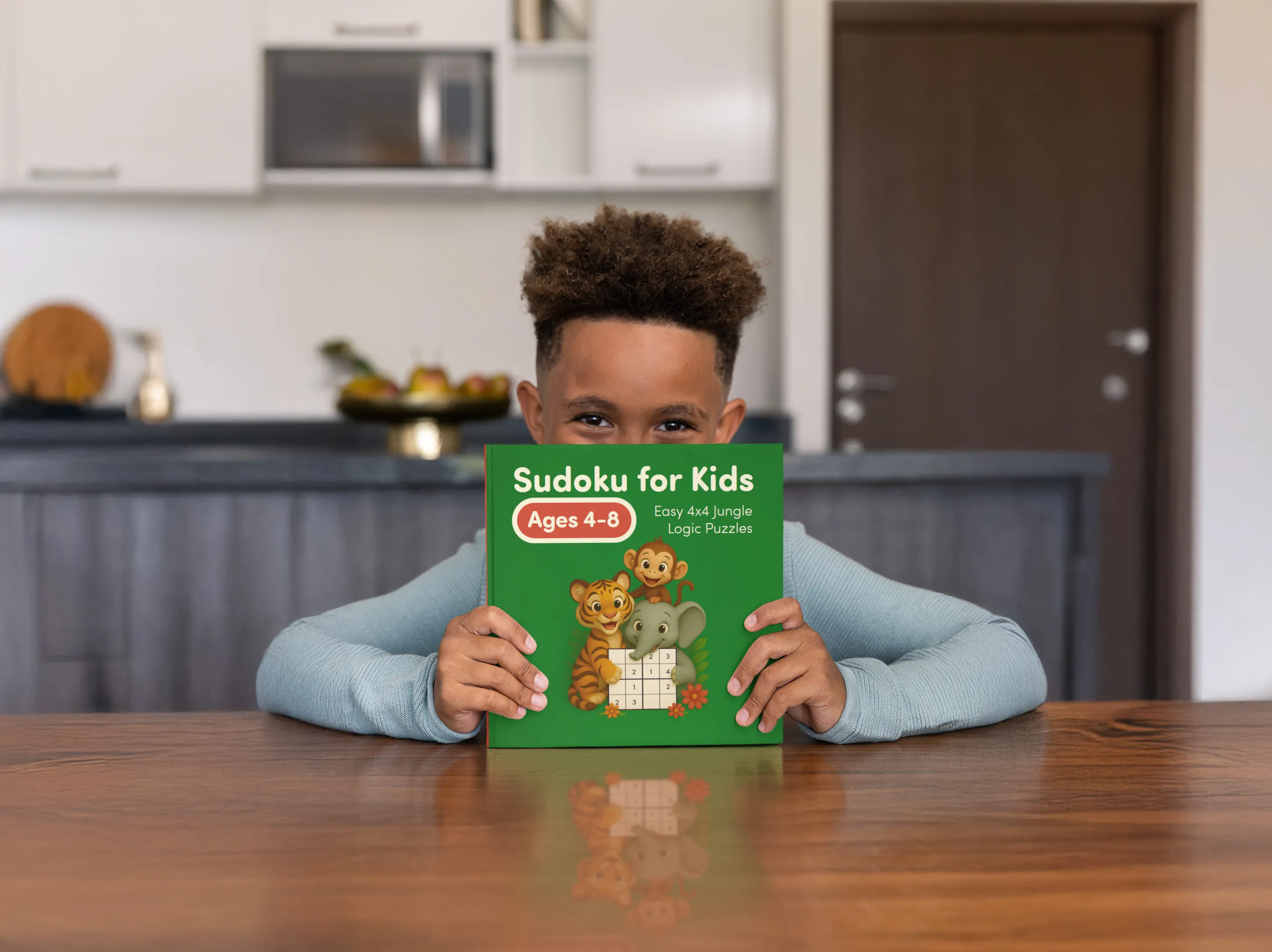 Kid holding Sudoku for Kids Jungle Logic Puzzles book