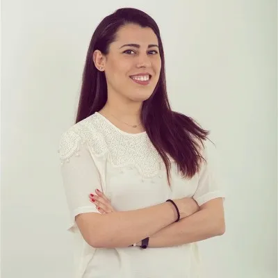 a woman with her arms crossed