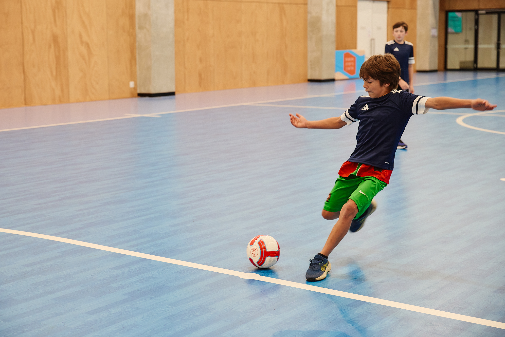 A team of Futsal players posing for a picture