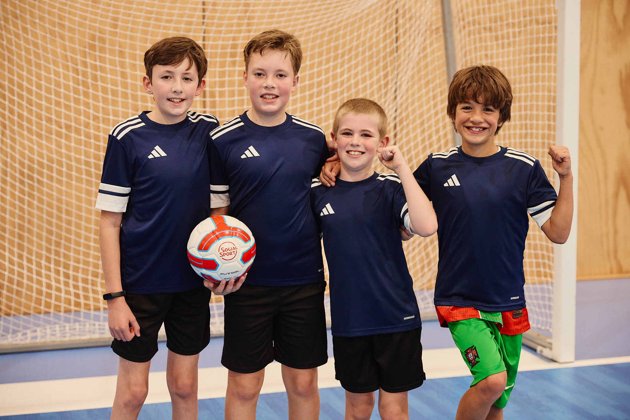 A team of Futsal players posing for a picture