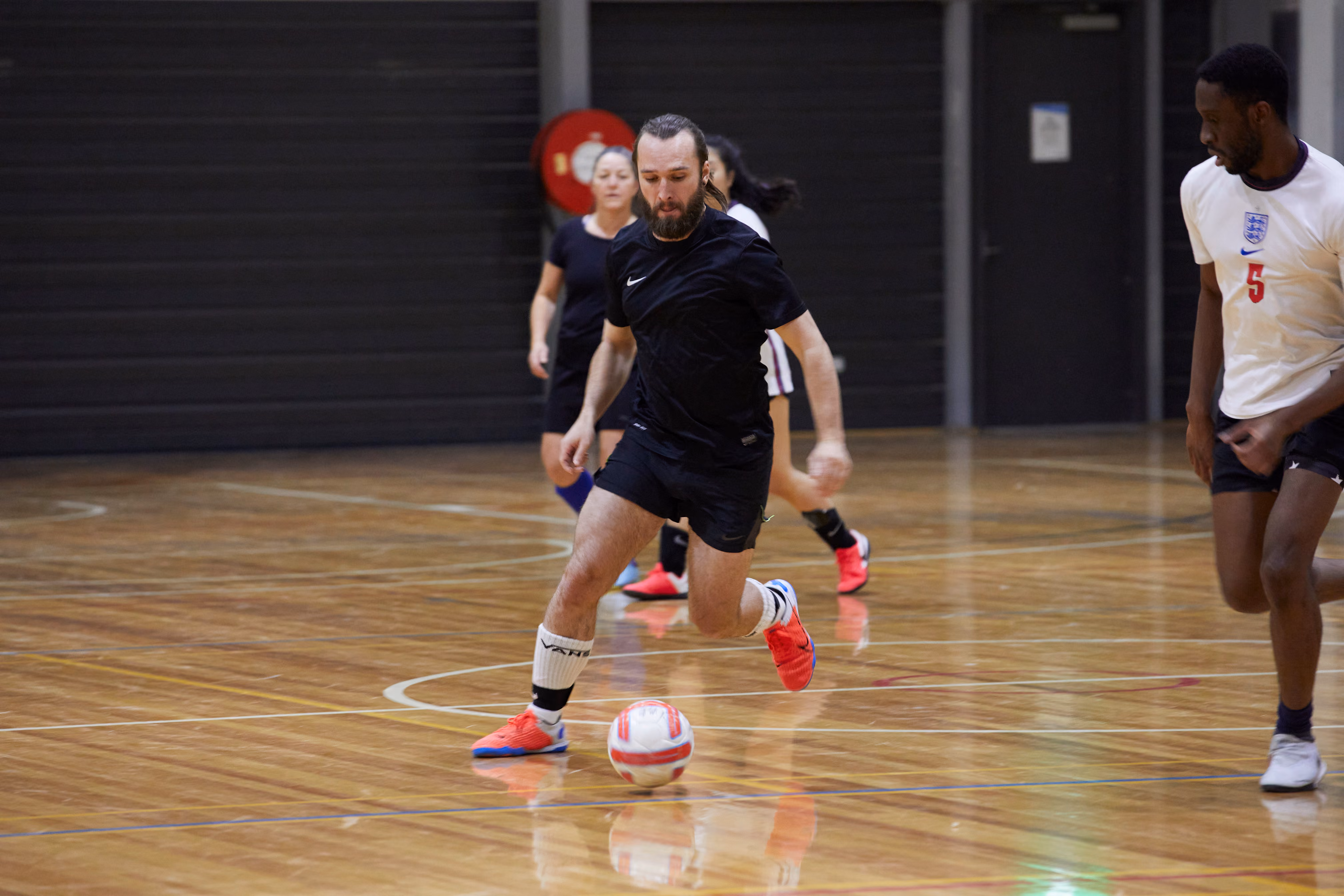 A team of Futsal players posing for a picture