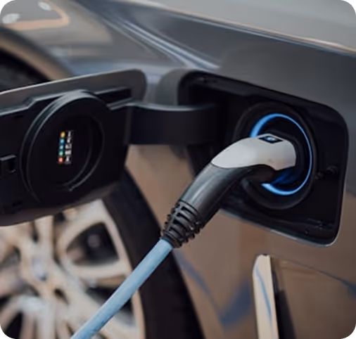 Electric car charging plug connected to the vehicle's charging port.