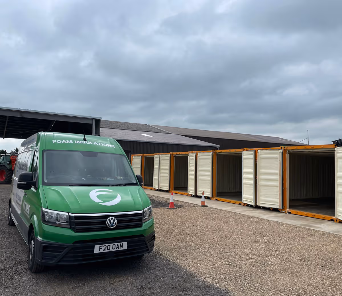 A row of shipping containers with spray foam insulation