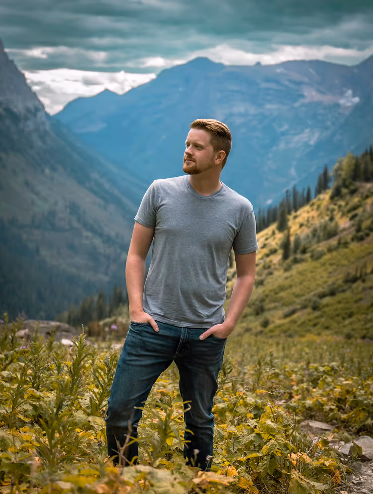 A headshot of Skeeter Johnston In Glacier National Park